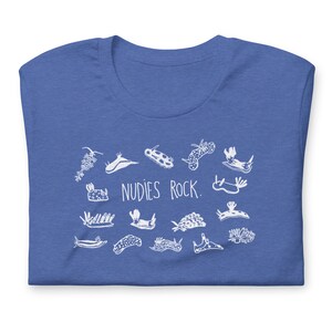 May include: A royal blue t-shirt with a white graphic of various sea slugs and the text "NUDIES ROCK."