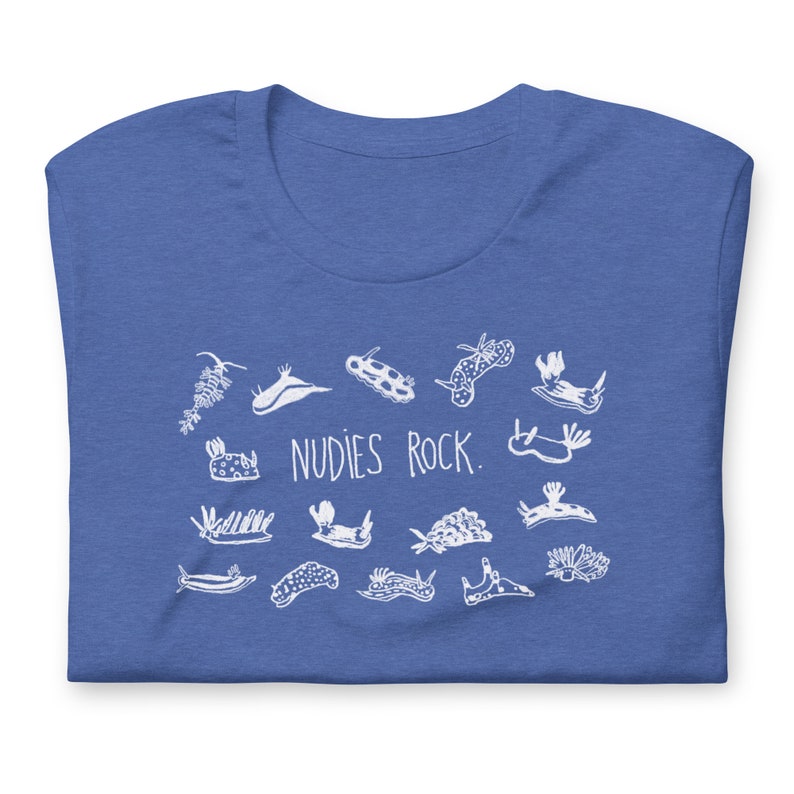 May include: A royal blue t-shirt with a white graphic of various sea slugs and the text "NUDIES ROCK."