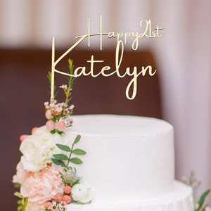 Personalized happy 21st Cake Topper in Gold on a white tiered cake with pale pink flowers