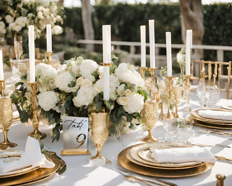 Gold Mirror Table Numbers for Weddings and Events on a White table with gold accents and white flowers