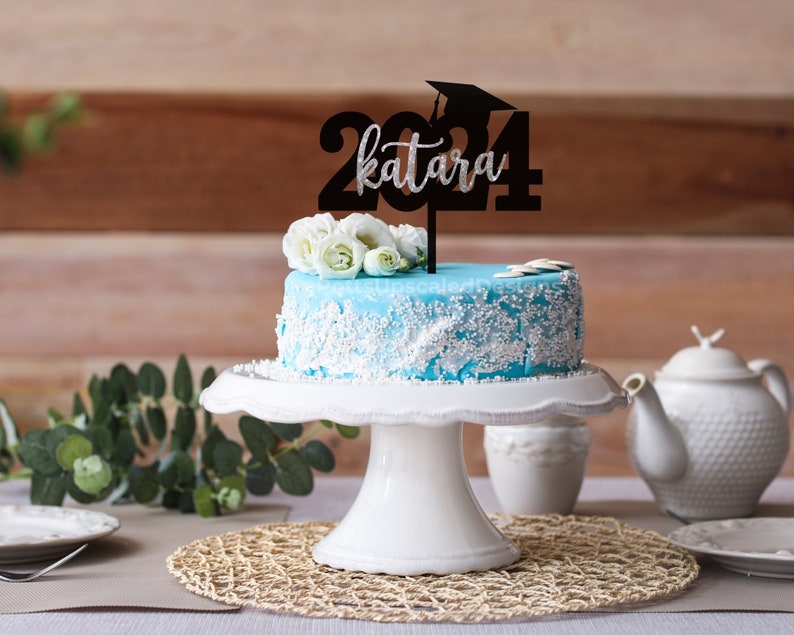 2024 Graduation year and cap cake topper personalized with the graduate name in black and silver glitter