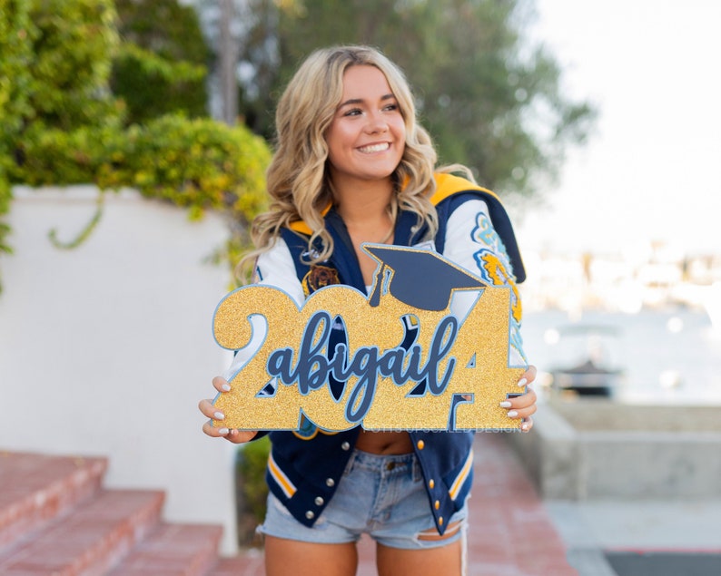 Graduation Sign personalized with graduate's name and school colors for senior portraits