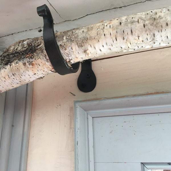 Brackets to hold a birch branch and woven swag curtain bronze hand forged natural