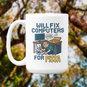 May include: White ceramic mug with a humorous graphic. The design features a cartoon of a person fixing a computer under a desk, with the text "WILL FIX COMPUTERS FOR PIZZA". A pizza box is on the desk.