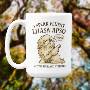 May include: White ceramic mug with a Lhasa Apso dog illustration. The mug features the text "I Speak Fluent Lhasa Apso" with the dog in a speech bubble saying "HMPH!" and the phrase "-MOSTLY HAIR AND ATTITUDE-".