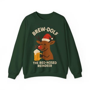 May include: Dark green sweatshirt with a graphic of a reindeer wearing a Santa hat and holding a beer mug. The text "BREW-DOLF" and "THE RED-NOSED REINDEER" are printed above and below the reindeer illustration.