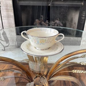 May include: A rustic wooden sign with the text "Welcome to our home" in white lettering. The sign features a distressed finish and a simple, inviting design, perfect for front door decor.