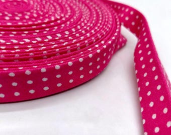 Bright Pink with white dots 1/2 inch double fold bias tape made of 100% cotton washed so no shrinkage sold by the yard.