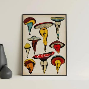 May include: A framed art print featuring whimsical mushroom illustrations. Each mushroom is depicted with colorful caps and legs, showcasing a unique and playful design. The artwork is set against a neutral background, enhancing the vibrant colors of the mushrooms.