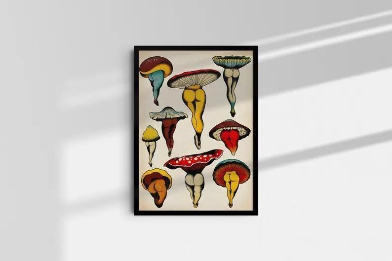 May include: A framed art print featuring a collection of whimsical mushroom illustrations. Each mushroom is depicted with a unique color palette, including red, yellow, blue, and brown. The artwork has a vintage aesthetic, with a cream-colored background.