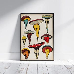 May include: A framed art print featuring whimsical mushroom illustrations. The mushrooms have colorful caps and are depicted with legs and buttocks. The artwork is displayed against a neutral background, with a black frame.