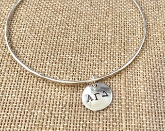 Sterling silver bangle with Greek letters