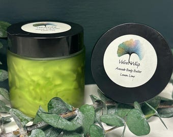 May include: A jar of green avocado body butter with a black lid and a label that reads "Velvet Whip Avocado Body Butter Lemon Lime".