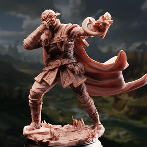 May include: A detailed, monochromatic figurine of a warrior in a dynamic pose. The figure wears armor, a cape, and holds a weapon with a decorative design. The warrior stands on a textured base, with a blurred landscape in the background.