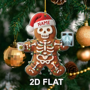May include: A gingerbread man Christmas ornament with a skeleton design, wearing a Santa hat with the word "NAME". The ornament holds an X-ray and a mug with a radiation symbol. It is decorated with colorful lights and the text "2D FLAT".
