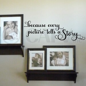 May include: Three framed black and white photographs on dark brown shelves against a light beige wall. The text "...because every picture tells a Story..." is above the frames. The photos depict children.