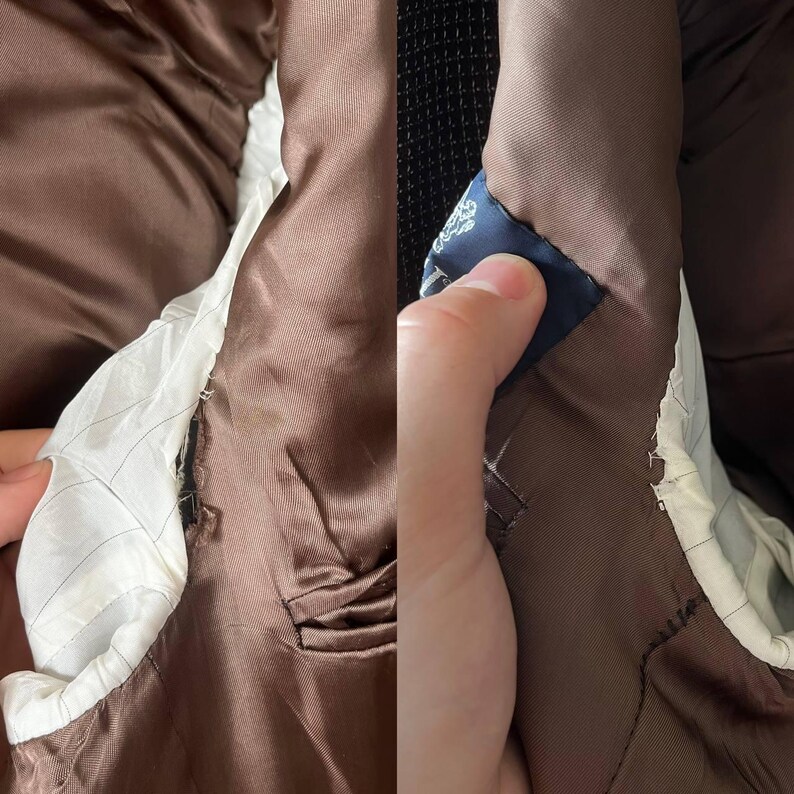 May include: Close-up of the interior of a brown blazer. The lining is white with a subtle pinstripe pattern. A small blue tag is visible. The blazer's fabric appears worn, with some visible damage and staining.