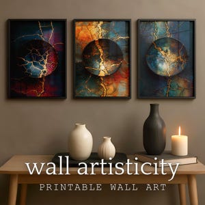 May include: Three framed abstract art prints with a dark background and a circular design with gold accents. The prints are displayed above a wooden table with vases and a candle. The text "wall artisticity" and "PRINTABLE WALL ART" are visible.