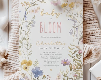 May include: A baby shower invitation with a floral design. The invitation reads "baby in bloom" and includes the text "Charlotte's Baby Shower" and details for the event.