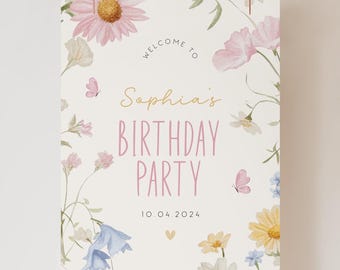 May include: A white printable sign with a floral design featuring pink, yellow, and blue flowers. The text on the sign reads "Welcome to Sophia's Birthday Party 10.04.2024".