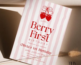 May include: A pink and white striped invitation card with the text "Berry First Birthday" in red. The card features a strawberry graphic and details for Olivia's 1st birthday, including date, time, and location.