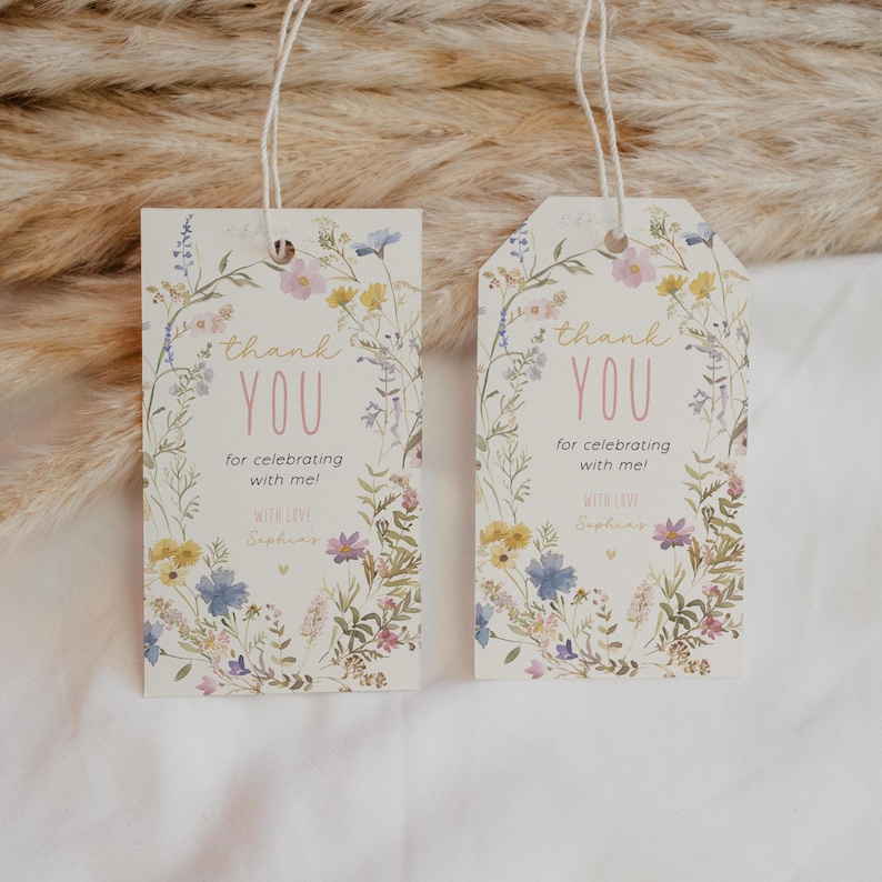 May include: Two white thank you tags with a floral design. The text on the tags reads "thank you for celebrating with me!" with love, "Sophia".