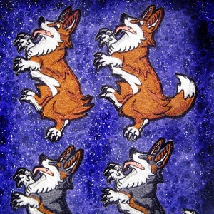 May include: Four embroidered patches of corgis in different poses against a blue and white starry background. The corgis are brown and white, and gray and white.