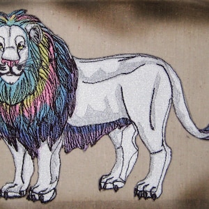 May include: A white lion with a rainbow mane and tail. The lion is standing on a brown background.