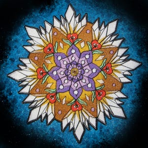 May include: A colorful mandala with a purple flower in the center surrounded by white, brown, and red petals. The mandala is set against a dark blue background with white speckles.