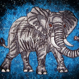 May include: A gray embroidered elephant with a blue starry background. The elephant has a long trunk and large ears.