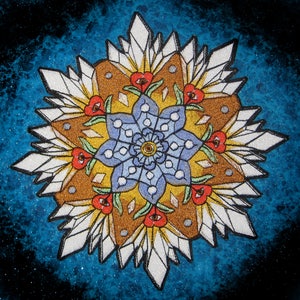 May include: A colorful mandala design with a blue flower in the center surrounded by white crystal-like shapes and red flowers. The background is a dark blue with a speckled texture.