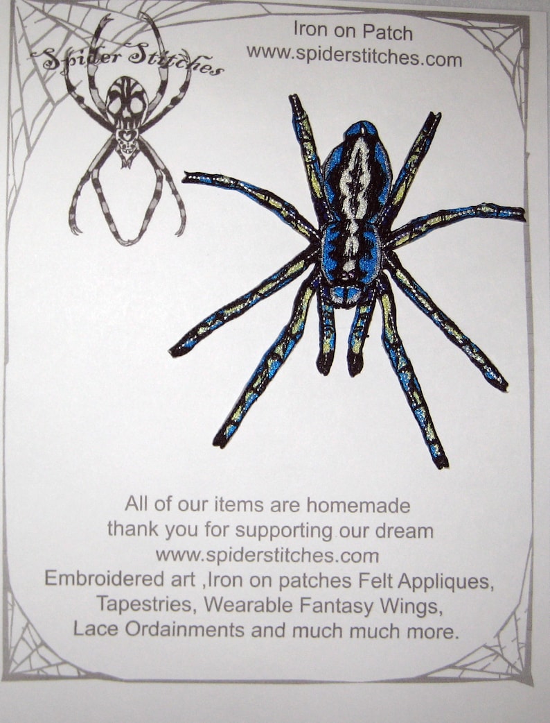May include: Iron-on patch featuring a blue and black spider with yellow accents. The patch is for sale on the website spiderstitches.com. The text "Spider Stitches" is in the top left corner of the image. The text "Iron on Patch" is in the top right corner of the image. The text "www.spiderstitches.com" is below the text "Iron on Patch". The text "All of our items are homemade thank you for supporting our dream www.spiderstitches.com Embroidered art, Iron on patches Felt Appliques, Tapestries, Wearable Fantasy Wings, Lace Ordainments and much much more." is at the bottom of the image.
