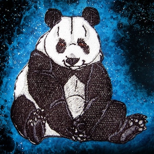 May include: A black and white embroidered panda bear patch with a galaxy background. The panda is sitting with its paws crossed and has a serious expression.
