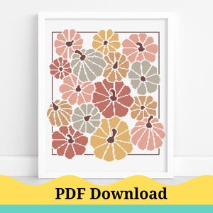 Può includere: Un'opera d'arte a punto croce incorniciata con una collezione di zucche nei toni del rosa, dell'arancione e del grigio. Le zucche sono disposte a grappolo, con un bordo marrone scuro. Il testo "PDF Download" è in basso.