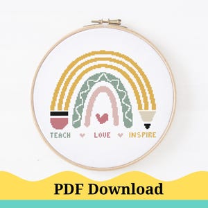 May include: A cross-stitch pattern featuring a rainbow with a pencil design and the words "Teach", "Love", and "Inspire".