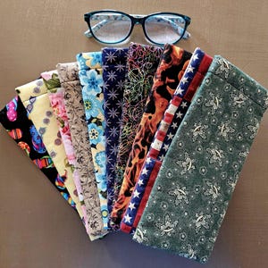 Sunglasses/eyeglass case, handmade with cotton fabric and fleece on the inside. Pinch sides at top to open. Made in USA