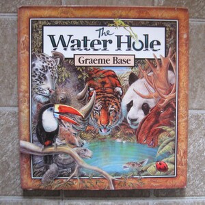 2001 First Published Edition - The Water Hole by Graeme Base - Hardcover Book with Dust Jacket - Watercolor Illustrations
