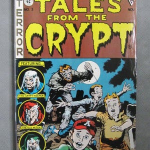 May include: A vintage comic book titled "Tales From The Crypt" No. 3. The cover features a horror-themed illustration with the text "Double-Sized Horror!" and "Terror". The comic book has a price tag of $1.95.