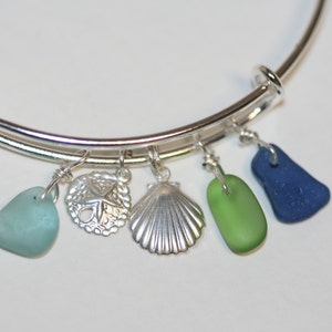 Adjustable silver bracelet with sterling silver sand dollar, seashell charm and pretty genuine sea glass