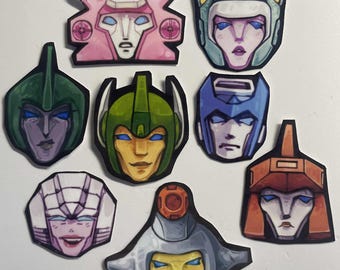 various transformer stickers - megaop keychain, beast wars, g1, shockwave, beachcomber, team bullet train, dinobots,