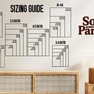 May include: A wall display showing a "SIZING GUIDE" with different aspect ratios, including 1:1, 2:3, 3:4, 4:5, and 11:14. Each ratio displays dimensions in inches and centimeters. The text "Soup Parade" is displayed in a brown font.