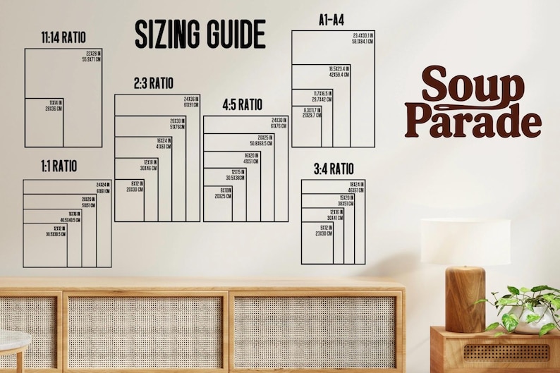 May include: A wall display showing a "SIZING GUIDE" with different aspect ratios, including 1:1, 2:3, 3:4, 4:5, and 11:14. Each ratio displays dimensions in inches and centimeters. The text "Soup Parade" is displayed in a brown font.
