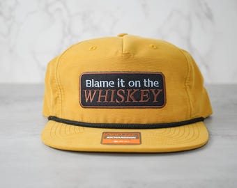 Geef de schuld aan de whisky: grappige snapbackhoed in vintage-stijl