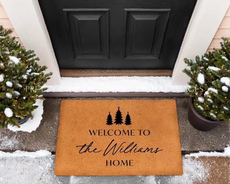 May include: A brown coir welcome mat with the text "Welcome to the Williams Home" and three stylized evergreen trees.