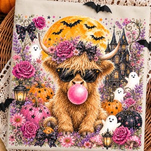 May include: A rectangular canvas print featuring a fluffy highland cow wearing black sunglasses and blowing a pink bubble. The scene includes a large yellow moon, a dark castle, pink roses, orange and black pumpkins, and white ghosts.
