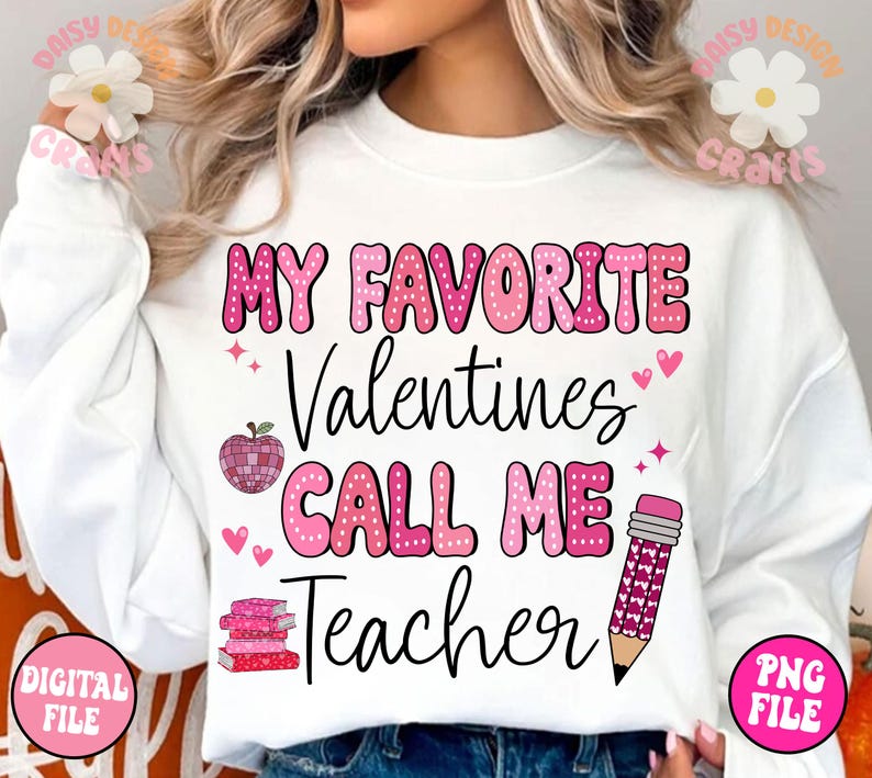 May include: White sweatshirt with pink polka dot lettering that reads "My Favourite Valentines Call Me Teacher". The text is surrounded by pink hearts, a pink apple, and a pink pencil.