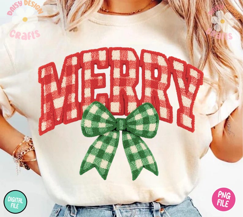 May include: Cream-colored t-shirt with the word "MERRY" in red and white plaid lettering. A green and white plaid bow is centered below the word. The shirt has a casual, festive design, perfect for the holiday season.