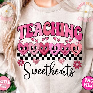 May include: A pink and white graphic design with the text "Teaching Sweethearts" in a retro font. The design features a row of pink hearts with faces, a checkered pattern, and pink flowers.