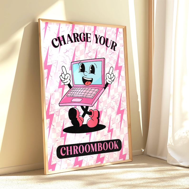 May include: A pink and white poster with a cartoon laptop character. The laptop has a smiling face and is holding up its hands. The text on the poster says "CHARGE YOUR CHROOMBOOK".