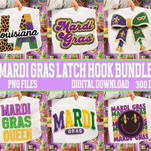 May include: A collection of white t-shirts featuring Mardi Gras designs. Designs include the word "Louisiana" with a leopard print "L" and a green and purple "A", the words "Mardi Gras", a bow, and a smiley face with a fleur-de-lis.